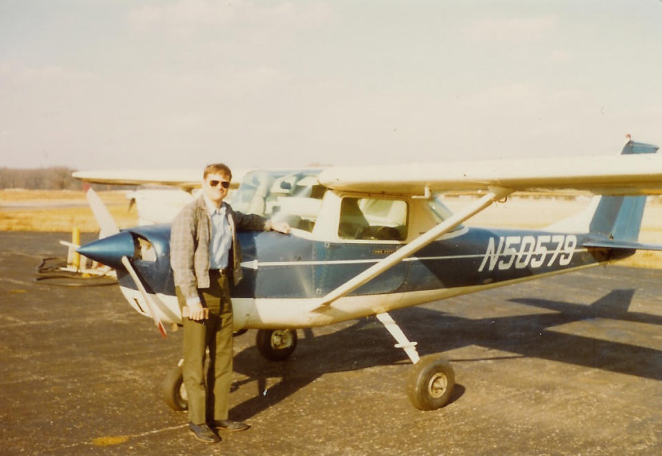 Jim standing next to airplane